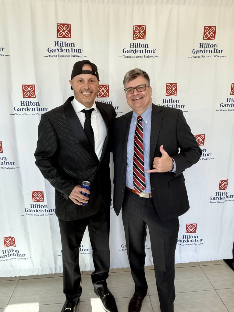 Stephen Garcia with a guest at the gala step-and-repeat