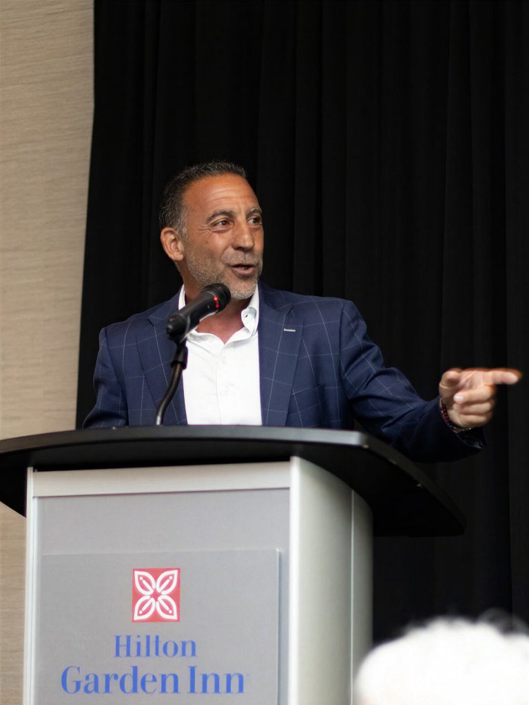 A speaker addresses the room during the gala program