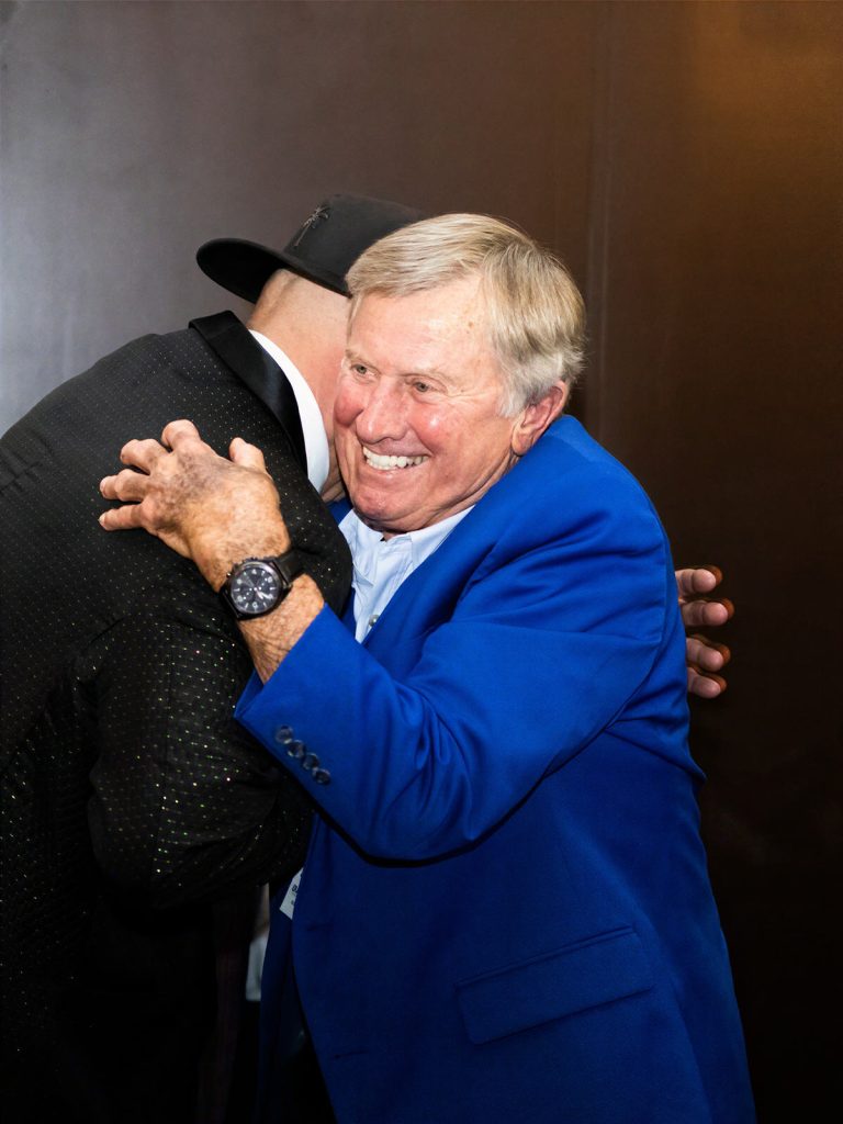 An embrace at the Quarterback Your Health Gala